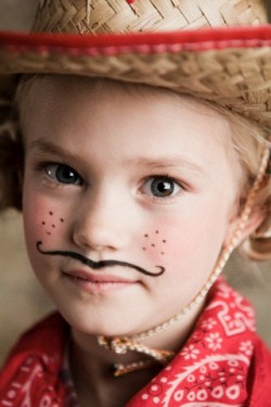 Young girl dressed up as cowgirl --- Image by © Image Source/Corbis